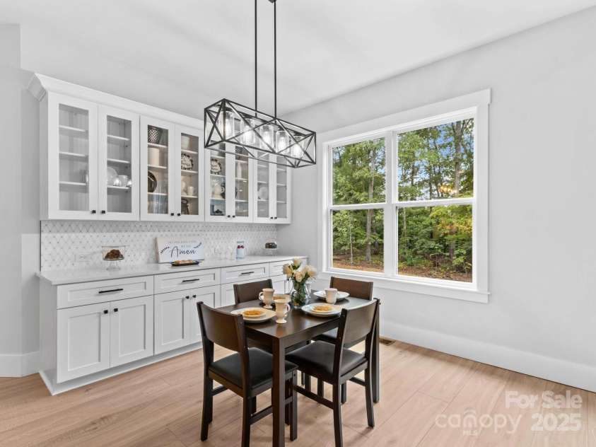 1075 Lake Wright Road, China Grove, NC 28023.  MLS# CAR4278354, YatesRealty ID 31532. Buffet serving area in Kitchen & place to display dishes. You could serve a full meal here & not have to use your ten foot island. This home is made for modern entertaining.