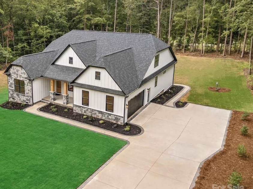 1075 Lake Wright Road, China Grove, NC 28023.  MLS# CAR4278354, YatesRealty ID 31532. Driveway can park 12 cars plus oversize 2 Car Garage with space for extra storage & refrigerator.