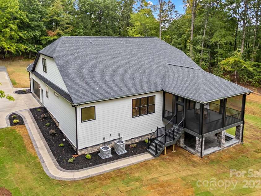 1075 Lake Wright Road, China Grove, NC 28023.  MLS# CAR4278354, YatesRealty ID 31532. Exterior has hardie plank & stone siding for low maintenance. New sod grass added.