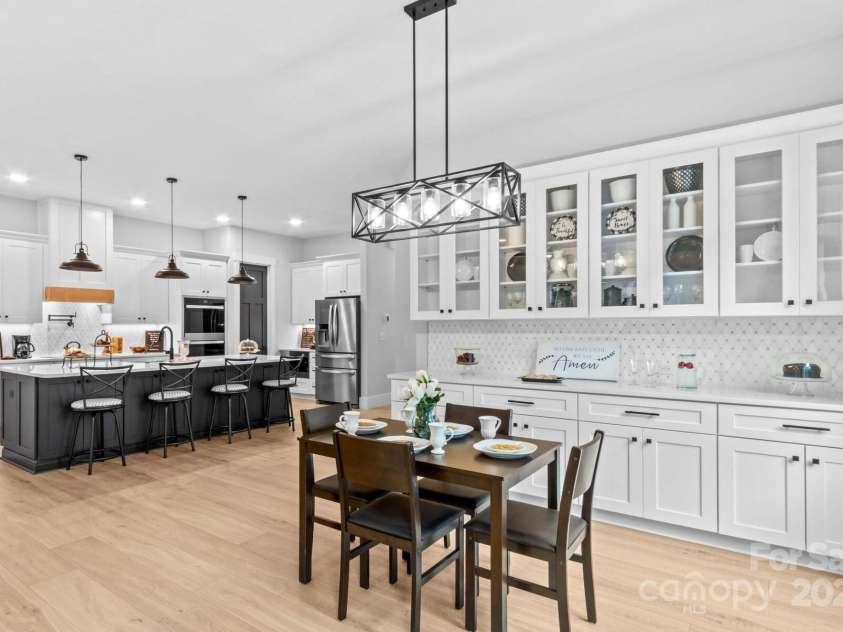 1075 Lake Wright Road, China Grove, NC 28023.  MLS# CAR4278354, YatesRealty ID 31532. Gourmet Kitchen with double ovens, pot filler, quartz counters, ten foot island & Buffet serving area.