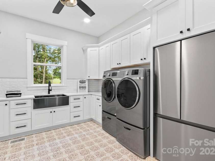 1075 Lake Wright Road, China Grove, NC 28023.  MLS# CAR4278354, YatesRealty ID 31532. Laundry room so large it takes two photos to show. The appliances in here are virtually staged.