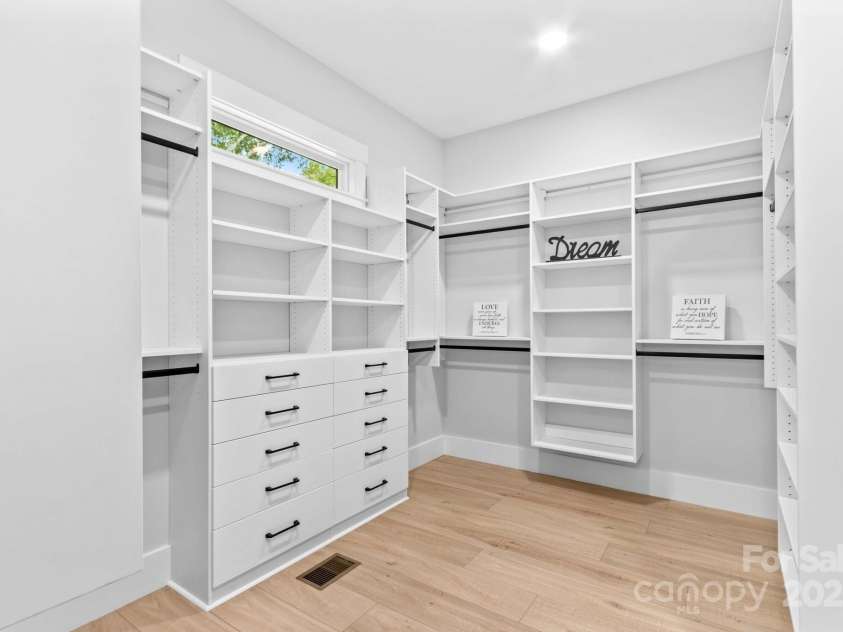 1075 Lake Wright Road, China Grove, NC 28023.  MLS# CAR4278354, YatesRealty ID 31532. Main closet needs 3 photos to show custom organizers & how large it is with three sections.