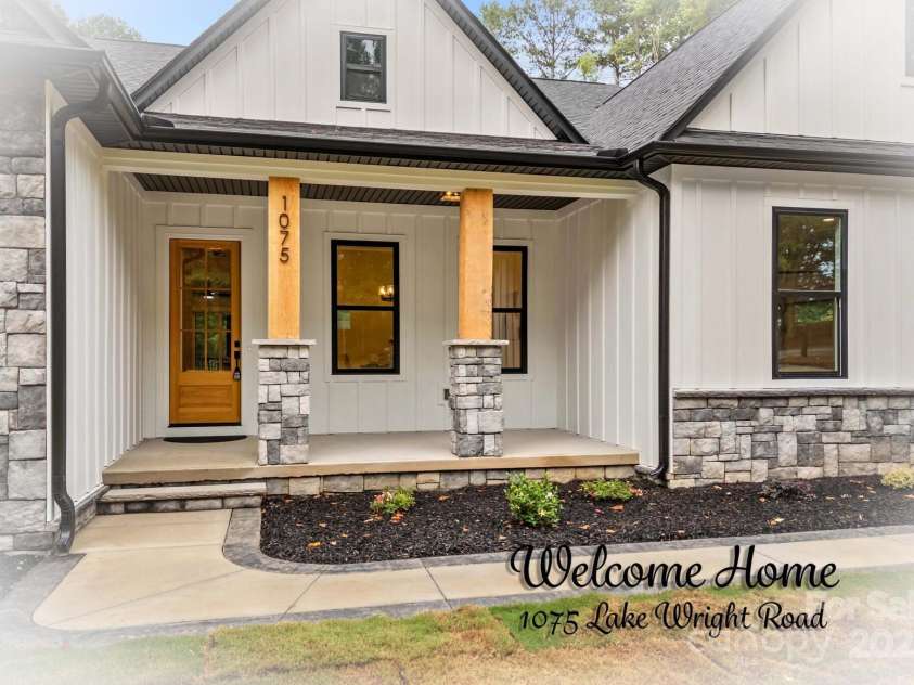 1075 Lake Wright Road, China Grove, NC 28023.  MLS# CAR4278354, YatesRealty ID 31532. Rocking chair front porch welcomes you.