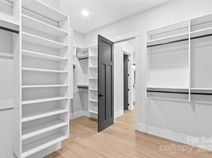 1075 Lake Wright Road, China Grove, NC 28023.  MLS# CAR4278354, YatesRealty ID 31532. Seller spent $20,000 on custom organizers for all closets & pantry. Another part of main bedroom closet.