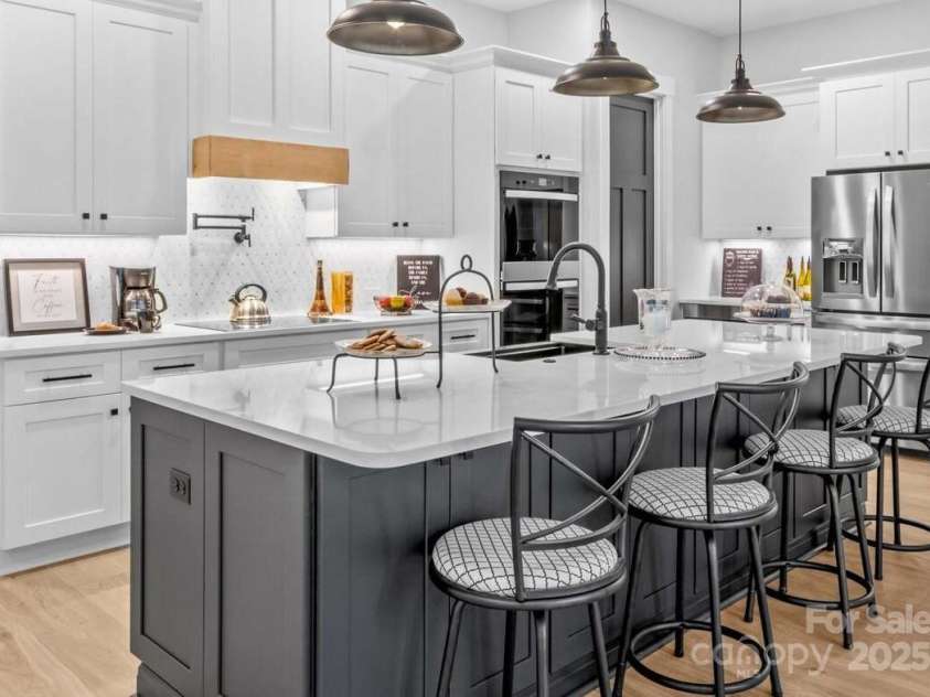 1075 Lake Wright Road, China Grove, NC 28023.  MLS# CAR4278354, YatesRealty ID 31532. Ten foot long quartz island with storage each side.