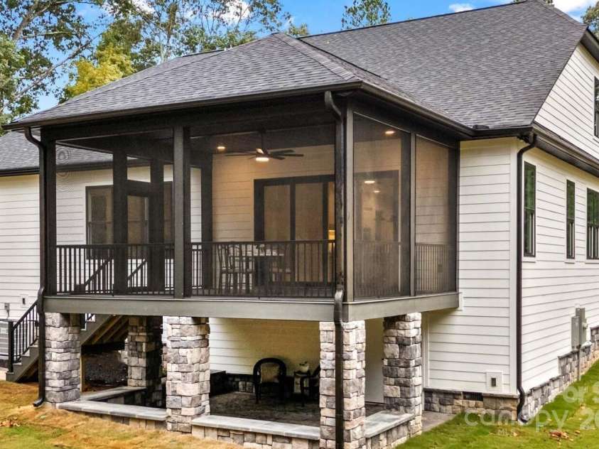 1075 Lake Wright Road, China Grove, NC 28023.  MLS# CAR4278354, YatesRealty ID 31532. Two Patios on the back of home. Both patios are covered.