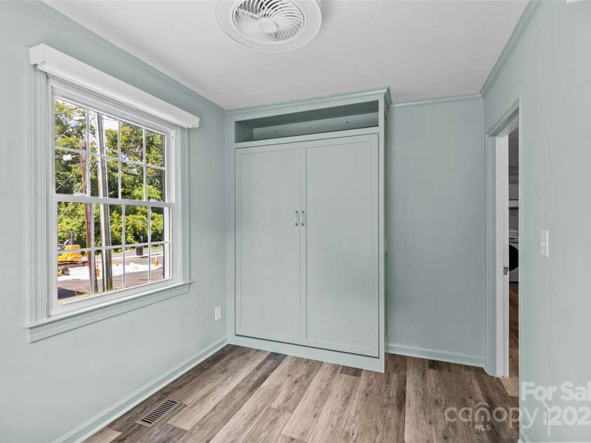 301 Wakefield Drive, Charlotte, NC 28209.  MLS# CAR4285273, YatesRealty ID 31534. Bedroom #1 with Murphy bed folded away for additinal floor space