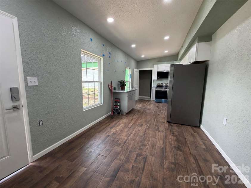 68 Circle Drive, Marion, NC 28752.  MLS# CAR4395560, YatesRealty ID 31536. View from Living area, toward open floor plan, dining and kitchen area.