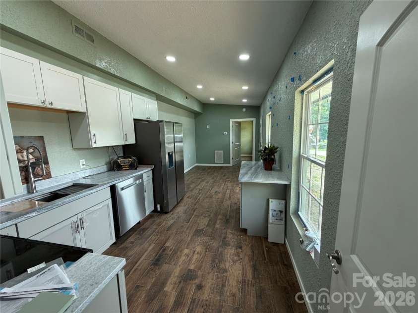 68 Circle Drive, Marion, NC 28752.  MLS# CAR4395560, YatesRealty ID 31536. View of Kitchen, Dining and Living Room open floor plan.