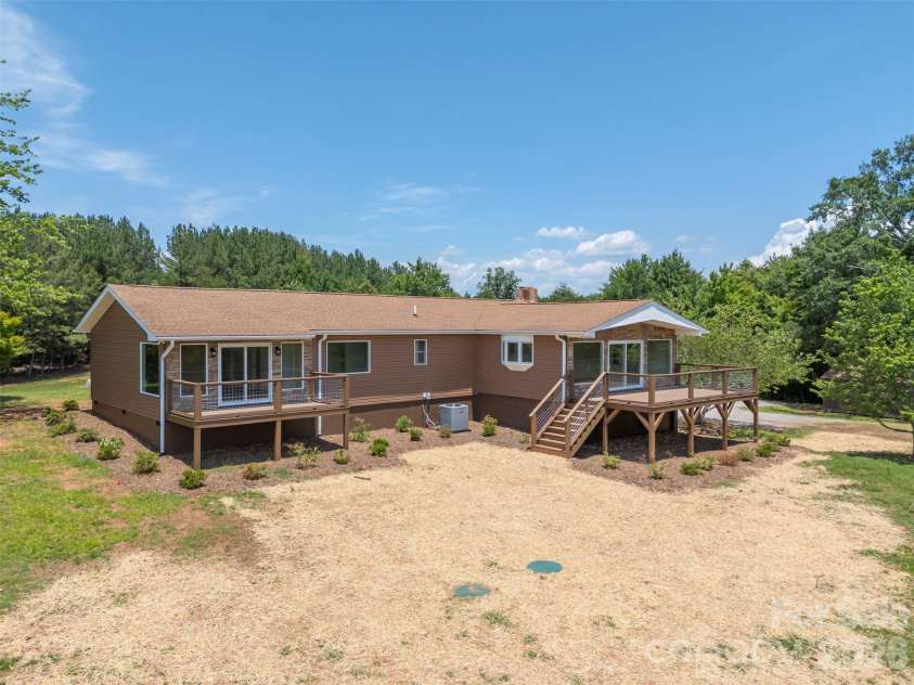 5732 Nc 9 Highway, Tryon, NC 28782.  MLS# CAR4395591, YatesRealty ID 31544. Backside with new decks