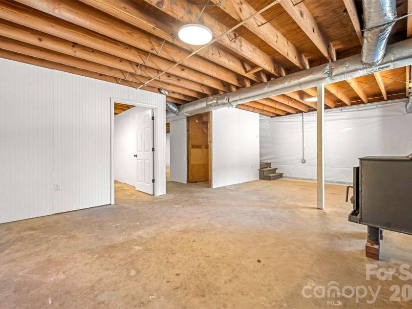 5732 Nc 9 Highway, Tryon, NC 28782.  MLS# CAR4395591, YatesRealty ID 31544. Large basement with lifetime guarantee water proofing