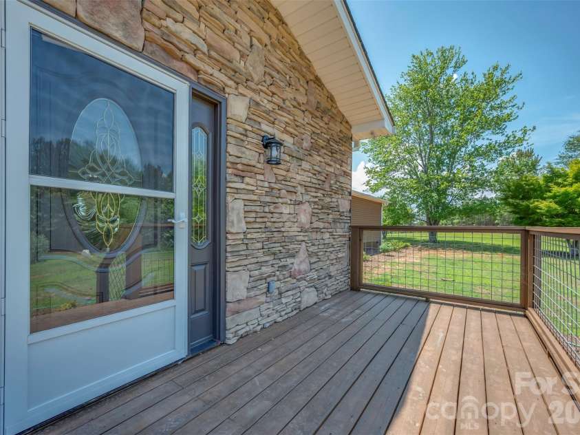 5732 Nc 9 Highway, Tryon, NC 28782.  MLS# CAR4395591, YatesRealty ID 31544. New deck for main entrance