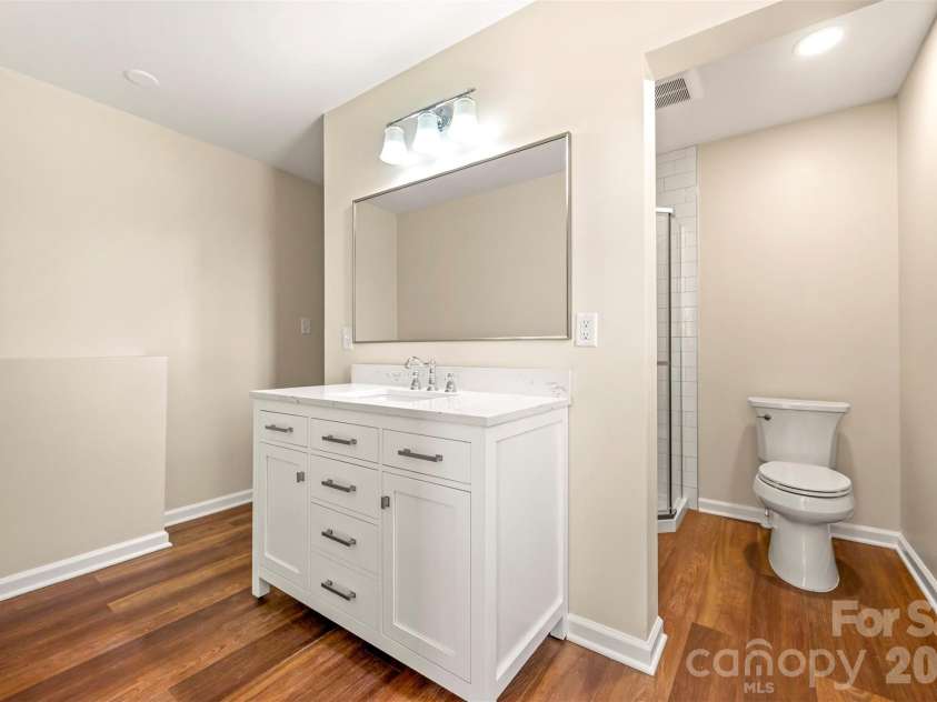 5732 Nc 9 Highway, Tryon, NC 28782.  MLS# CAR4395591, YatesRealty ID 31544. Shared bathroom with new shower and vanity