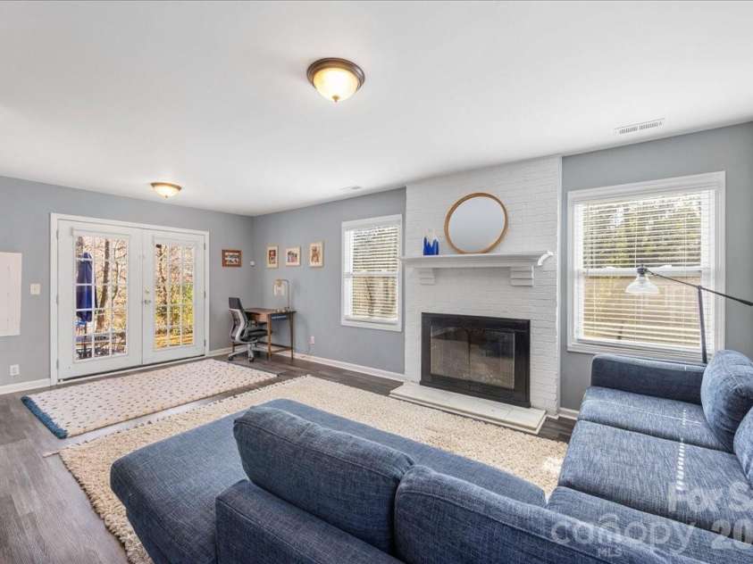 4914 Glenbrier Drive, Charlotte, NC 28212.  MLS# CAR4384998, YatesRealty ID 31554. Large den with fireplace
