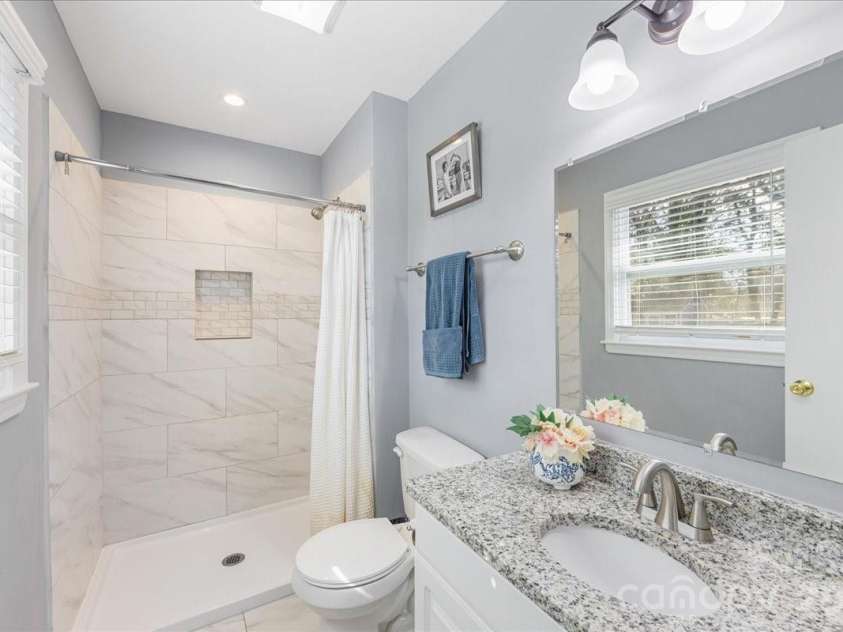 4914 Glenbrier Drive, Charlotte, NC 28212.  MLS# CAR4384998, YatesRealty ID 31554. Primary bath with shower