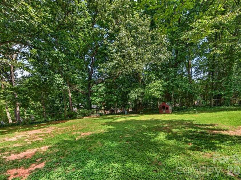 4914 Glenbrier Drive, Charlotte, NC 28212.  MLS# CAR4384998, YatesRealty ID 31554. Trees provide nice privacy