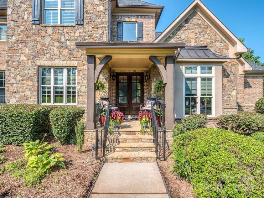 1377 Shinnecock Lane, Fort Mill, SC 29707.  MLS# CAR4273479, YatesRealty ID 31557. Covered Front Porch is inviting & large enough for a couple of rocking chairs!