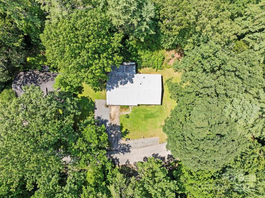 150 Deerwoode Lane, Brevard, NC 28712.  MLS# CAR4257546, YatesRealty ID 31558. Aerial/Private Setting