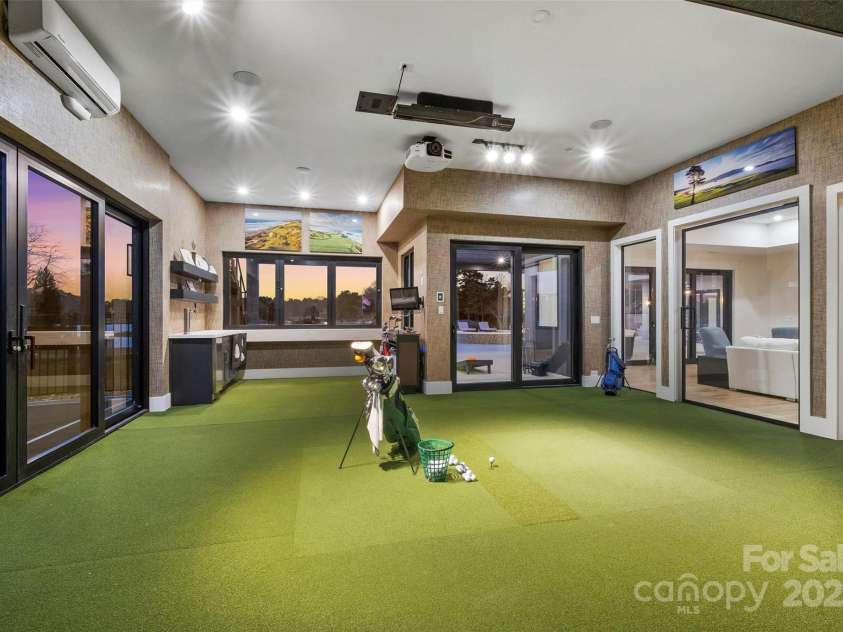 17235 Connor Quay Court, Cornelius, NC 28031.  MLS# CAR4291323, YatesRealty ID 3156. Golf Simulator Room 