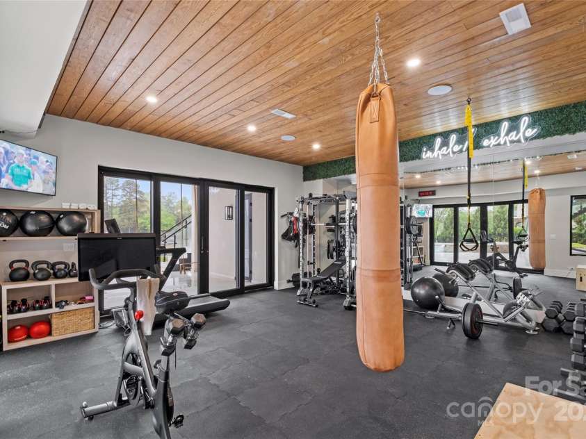 17235 Connor Quay Court, Cornelius, NC 28031.  MLS# CAR4291323, YatesRealty ID 3156. Lower Level Gym 