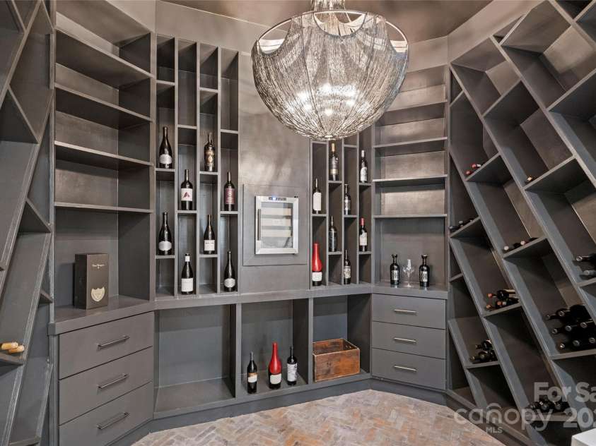 17235 Connor Quay Court, Cornelius, NC 28031.  MLS# CAR4291323, YatesRealty ID 3156. Lower Level Wine Room 