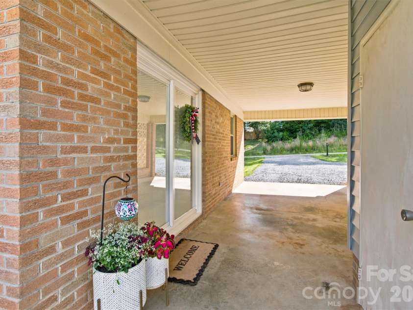 4608 Rainbow Drive, Kannapolis, NC 28081.  MLS# CAR4393962, YatesRealty ID 31562. Carport with convenient sliding doors right into home