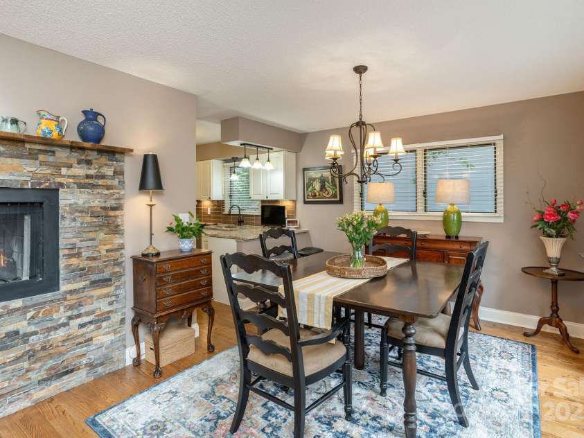 210 Claymoor Court, Flat Rock, NC 28731.  MLS# CAR4289864, YatesRealty ID 31569. Dining area with fireplace