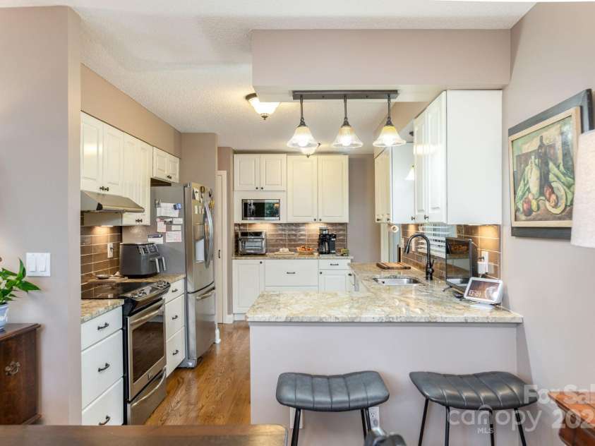 210 Claymoor Court, Flat Rock, NC 28731.  MLS# CAR4289864, YatesRealty ID 31569. Functional kitchen with breakfast bar