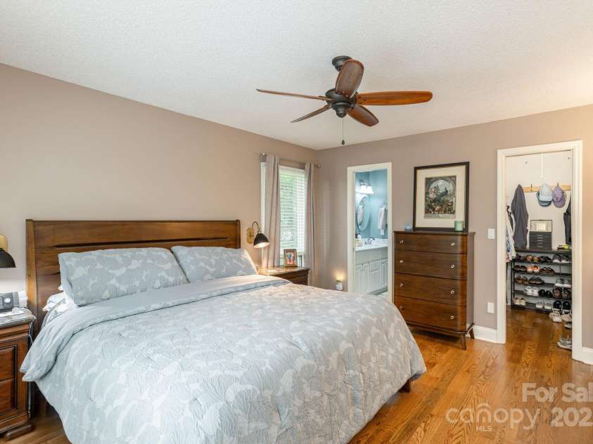 210 Claymoor Court, Flat Rock, NC 28731.  MLS# CAR4289864, YatesRealty ID 31569. Main level primary bedroom