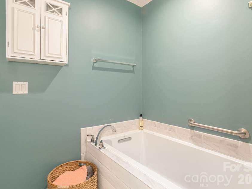 210 Claymoor Court, Flat Rock, NC 28731.  MLS# CAR4289864, YatesRealty ID 31569. Soaking tub in primary bathroom