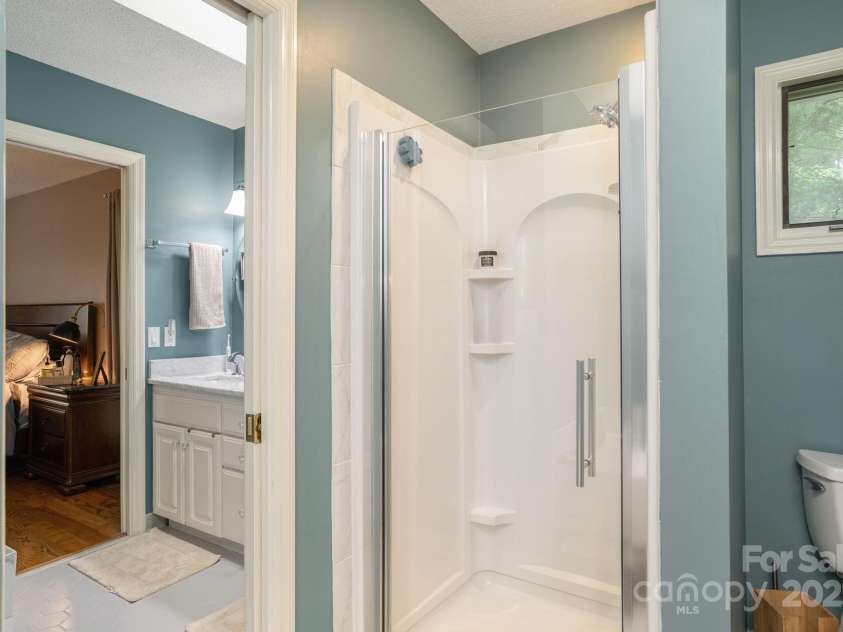 210 Claymoor Court, Flat Rock, NC 28731.  MLS# CAR4289864, YatesRealty ID 31569. Walk-in shower in primary bathroom
