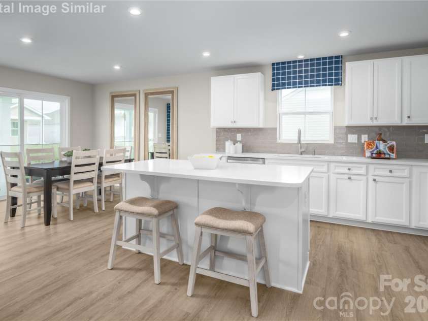 3283 Eller Drive Extension, Hickory, NC 28602.  MLS# CAR4340971, YatesRealty ID 3157. Connected Dining Space - Where Meals Bring Everyone Closer.