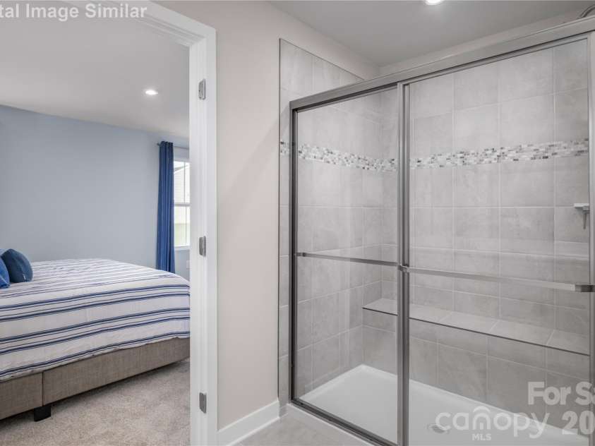 3283 Eller Drive Extension, Hickory, NC 28602.  MLS# CAR4340971, YatesRealty ID 3157. Relax and refresh in this chic ensuite with framed shower.