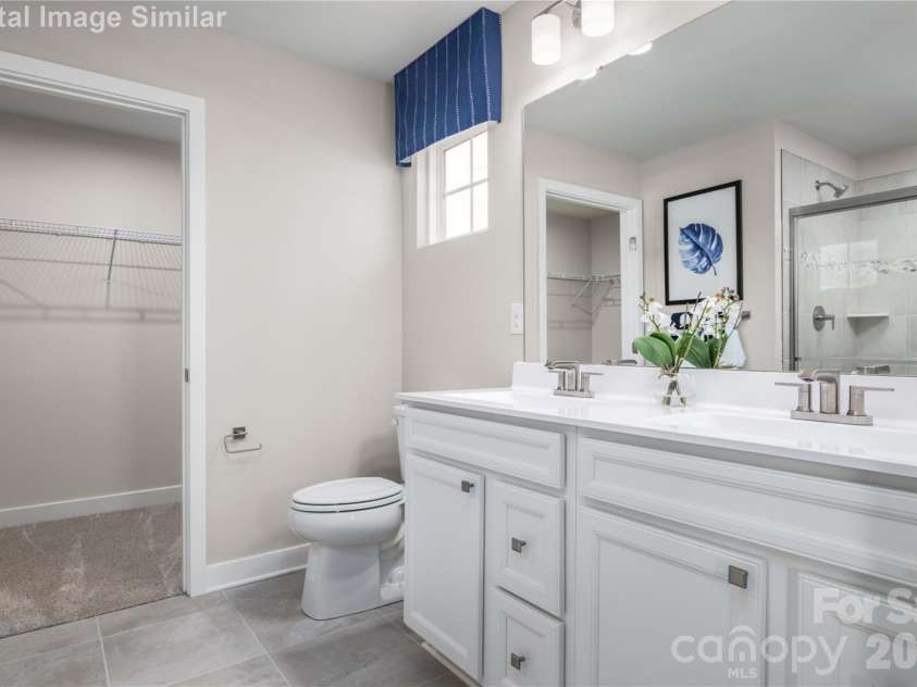 3283 Eller Drive Extension, Hickory, NC 28602.  MLS# CAR4340971, YatesRealty ID 3157. Style meets function: dual vanity flowing into your own walk-in closet.