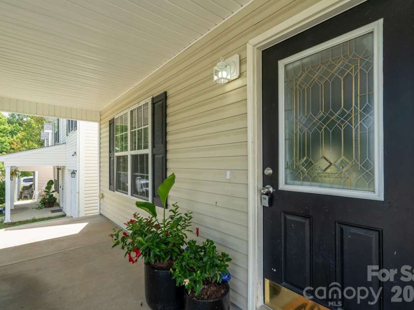 8016 Bronze Pike Drive, Charlotte, NC 28273.  MLS# CAR4394871, YatesRealty ID 31572. Large covered porch
