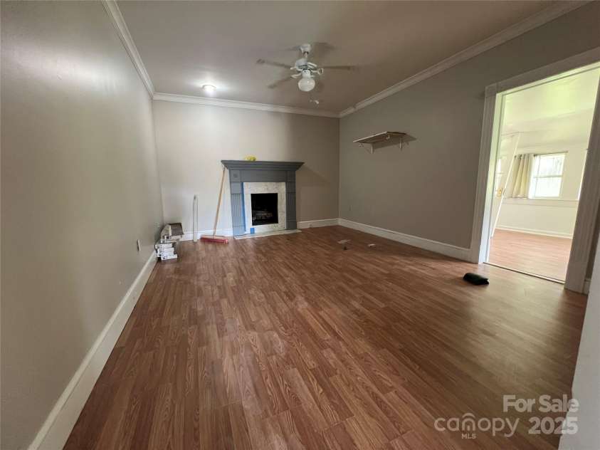 171 Mitchell Street, Rutherfordton, NC 28139.  MLS# CAR4282104, YatesRealty ID 31573. Living room with gas log fireplace