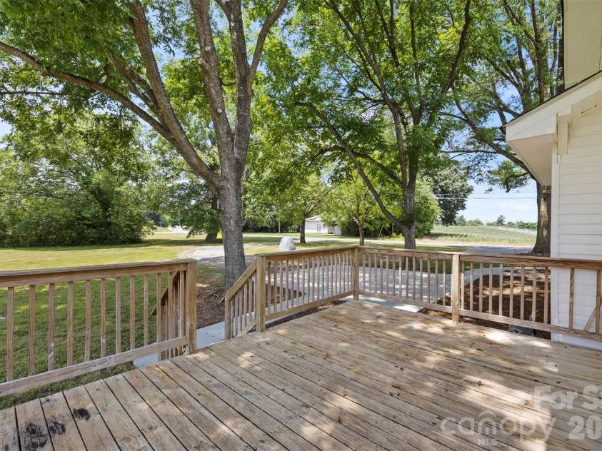 24327 Ridgecrest Road, Locust, NC 28097.  MLS# CAR4393477, YatesRealty ID 31577. Side deck is perfect for cookouts!