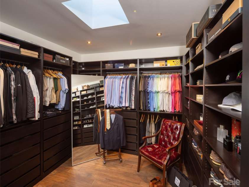 12 Sunset Summit, Asheville, NC 28804.  MLS# CAR4329108, YatesRealty ID 3158. Primary custom Walk-In closet with skylight