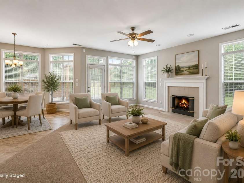 7001 Plough Drive, Mint Hill, NC 28227.  MLS# CAR4391731, YatesRealty ID 31591. Virtually Staged-The open-concept living room flows seamlessly into the kitchen and breakfast nook, creating the perfect space for everyday living and entertaining. Enjoy cozy evenings by the beautiful fireplace, then st