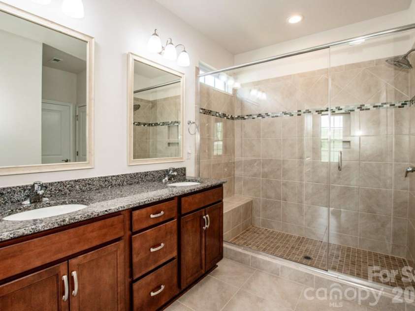 122 Coddle Way, Mooresville, NC 28115.  MLS# CAR4370294, YatesRealty ID 31603. Primary Bathroom has luxury tile shower and dual vanity