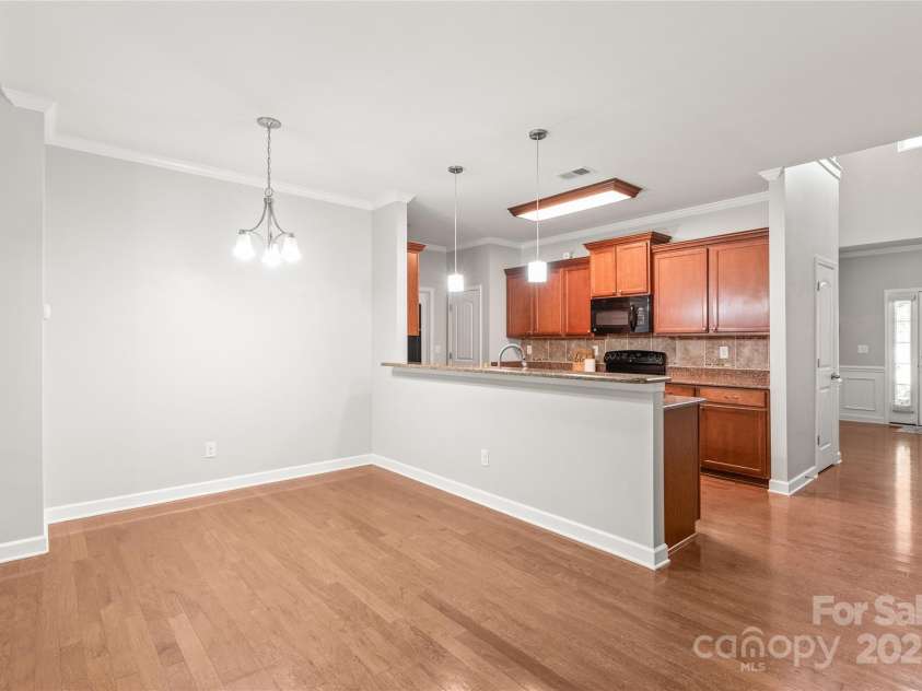 8513 Loxton Circle, Charlotte, NC 28214.  MLS# CAR4226710, YatesRealty ID 31606. Spacious dining space that flows nicely from the kitchen.