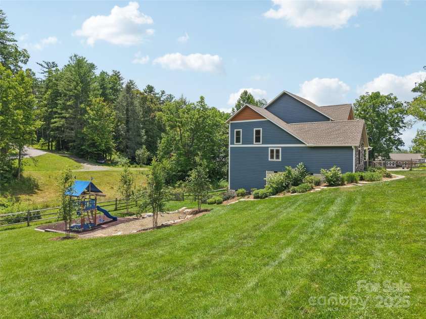 278 Ollie Weaver Road, Weaverville, NC 28787.  MLS# CAR4275482, YatesRealty ID 31609. Side Yard