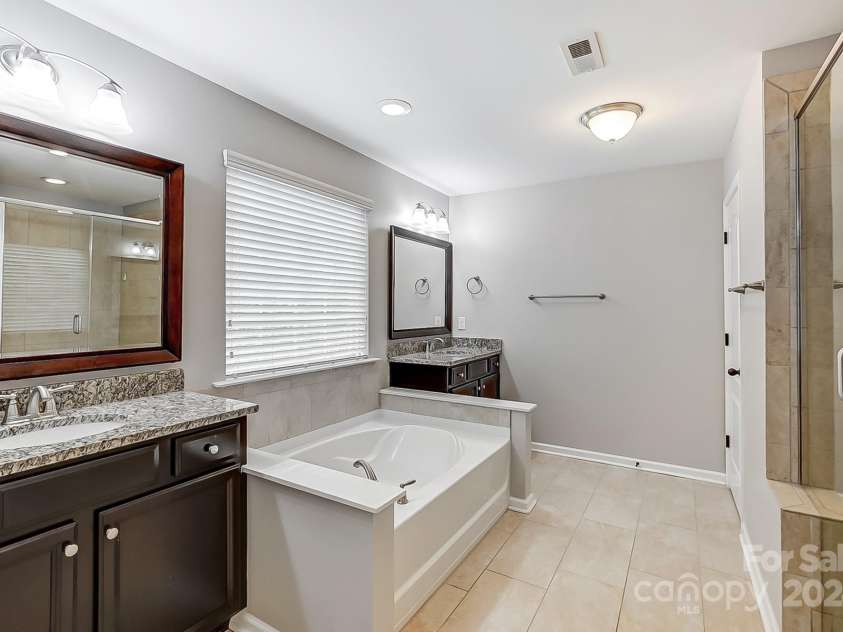 7006 Garden Hill Drive, Huntersville, NC 28078.  MLS# CAR4196907, YatesRealty ID 3161. Owner's Bathroom