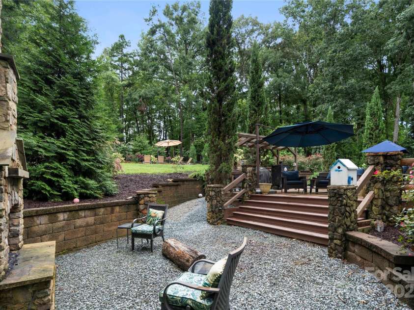 2216 Potter Cove Lane, Weddington, NC 28104.  MLS# CAR4291105, YatesRealty ID 31611. Back Deck leading to fireplace