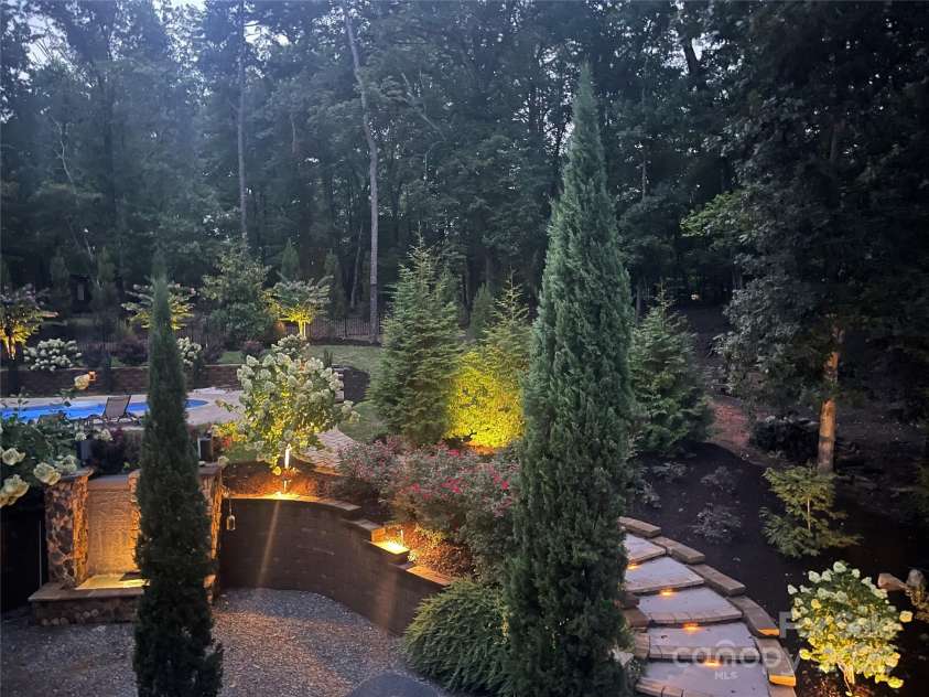 2216 Potter Cove Lane, Weddington, NC 28104.  MLS# CAR4291105, YatesRealty ID 31611. Back yard at night