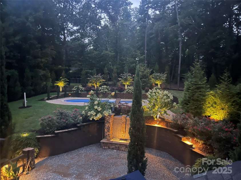 2216 Potter Cove Lane, Weddington, NC 28104.  MLS# CAR4291105, YatesRealty ID 31611. Back yard at night