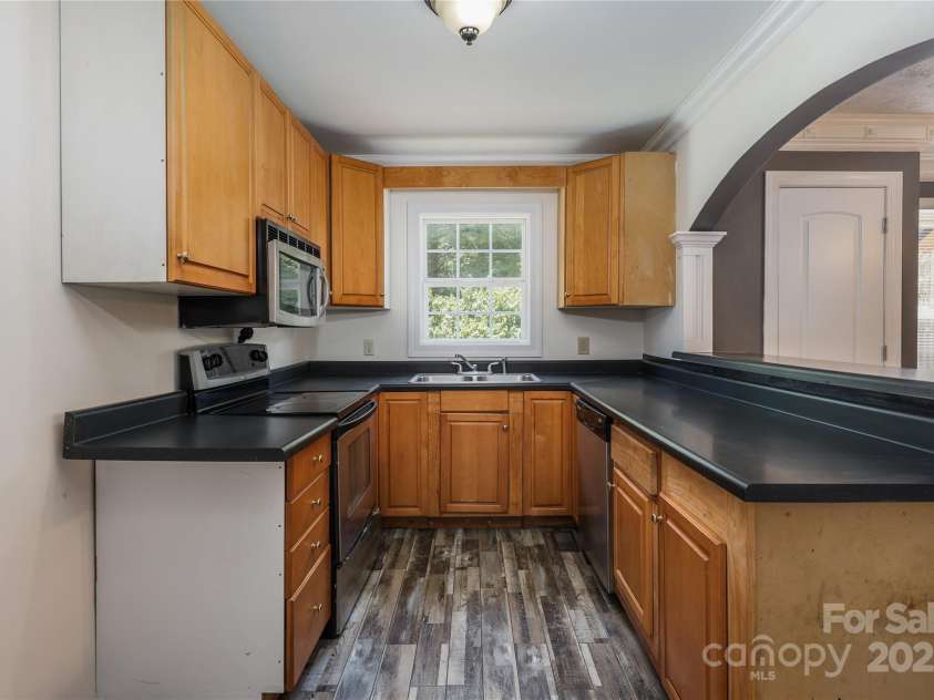 4651 Shiptontown Road, Denton, NC 27239.  MLS# CAR4286059, YatesRealty ID 31624. Kitchen with attached microwave, dishwasher