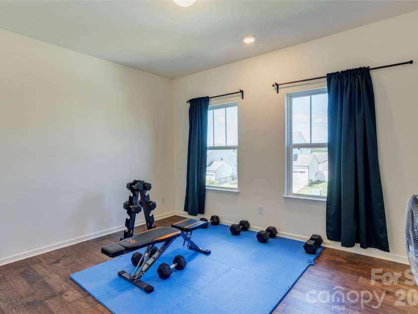 6319 Clarisse Drive, Concord, NC 28025.  MLS# CAR4393994, YatesRealty ID 31625. Bedroom currently used as a work out space