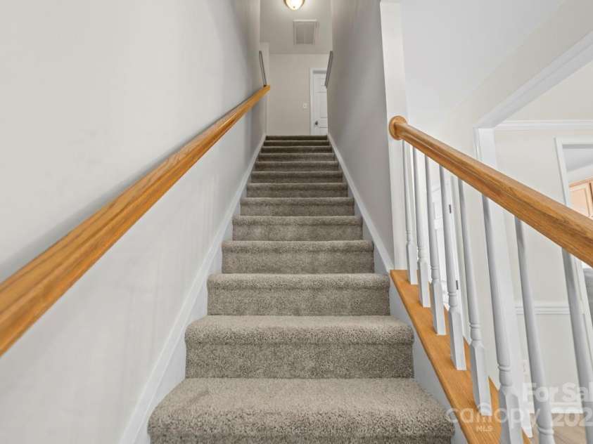 104 Arcadian Way, Mooresville, NC 28117.  MLS# CAR4288099, YatesRealty ID 31627. Staircase to upper level