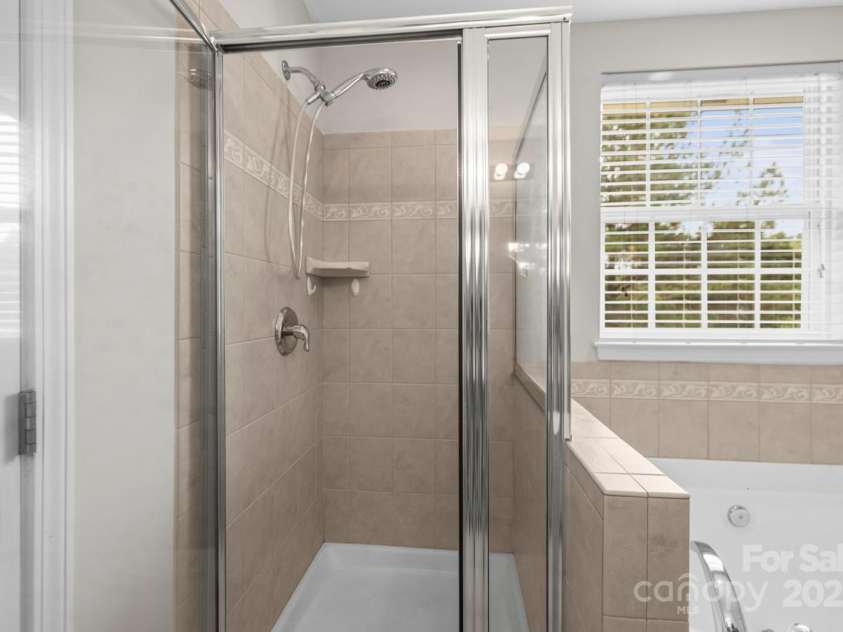 104 Arcadian Way, Mooresville, NC 28117.  MLS# CAR4288099, YatesRealty ID 31627. Tile shower in Primary Bathroom